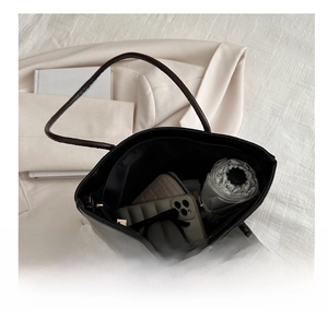 Top view of large capacity tote bag interior with pockets and daily essentials