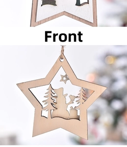 Macro detail of wooden star ornament with laser-cut snowman and winter scene motifs