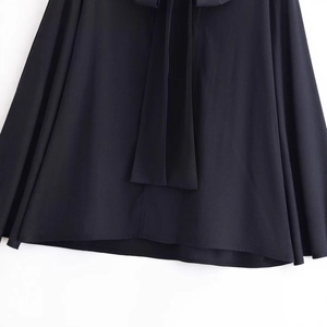 Minimalist black casual long sleeve shirt with bow ribbons and detailed hemline stitching