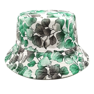 Reversible bucket hat for men and women with green floral leaf print on white canvas