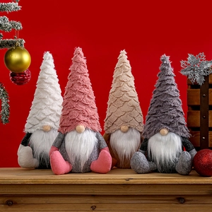 Set of four Nordic Christmas gnomes with feathered hats and white plush beards for decor