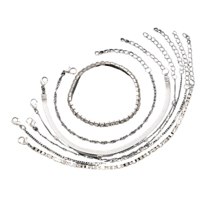 Detail view of 7-piece silver alloy chain bracelet set with rhinestone tennis and snake links
