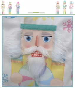 Detailed view of nutcracker soldier plush embroidery and 3D applique on Christmas gift bag