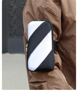 Detail of breathable striped sports arm bag showing fabric texture and dual zippers