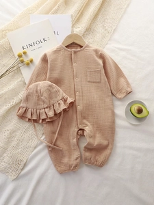 Infant long sleeve cotton gauze jumpsuit with matching ruffle hat in soft coral pink