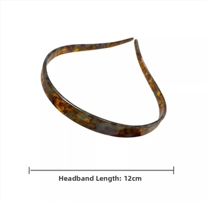 Detail view of tortoiseshell acetate headband showing 12cm width and non-slip slim design