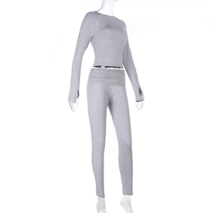 Detail of grey yoga set with thumbhole cuffs and high-waist foldover leggings