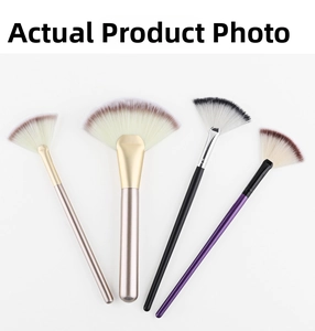 Macro view of four assorted fan makeup brushes with soft synthetic bristles and metallic handles