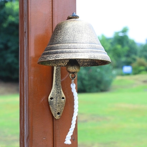 Retro industrial style cast iron doorbell with vintage bronze finish and white pull rope