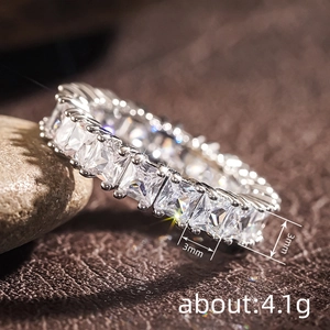 Macro shot of 3mm wide silver eternity ring with princess cut stones weighing 4.1g