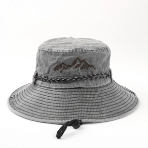 Detail of grey washed cotton bucket hat with mountain embroidery and windproof cord