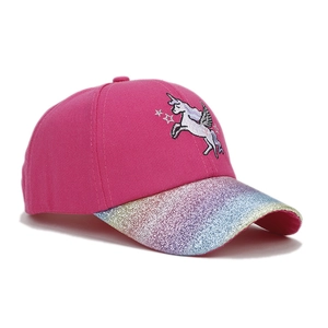 Detail of glitter brim and cute unicorn embroidery on kids pink baseball cap