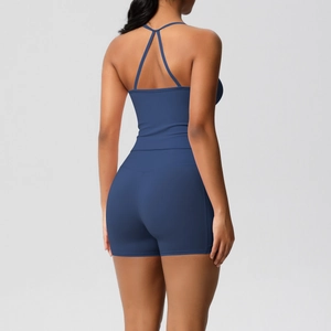 Back view of a navy blue yoga set featuring a racerback tank top and high-waisted shorts