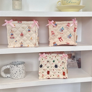 Quilted cotton storage basket with cute circus animal prints and pink ribbon bows