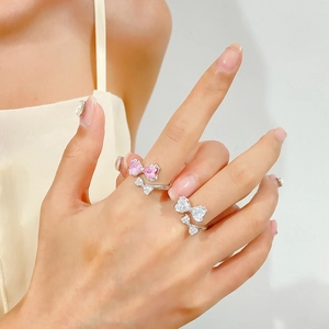 Chic silver bow ring with pink and clear cubic zirconia in an adjustable open design