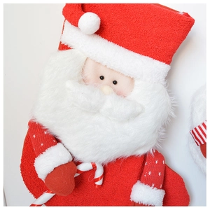 Detail of 3D Santa Claus plush Christmas stocking with red velvet and candy cane accent