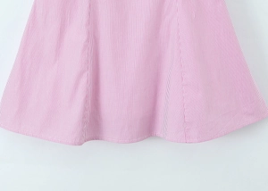 Close-up of pink and white striped woven fabric showing clean double-stitch hem detail