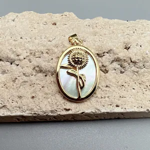 Detail of sunflower pendant with white mother of pearl inlay on natural rock base