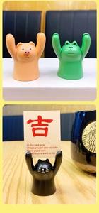Detail of cute animal resin figurine holders for spectacles and business cards