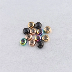Detailed close-up of 8mm stainless steel spacer beads with rubber stoppers in multiple finishes