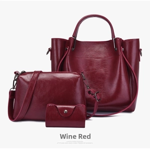 Three-piece women's set with tote, crossbody, and wallet in burgundy glossy finish