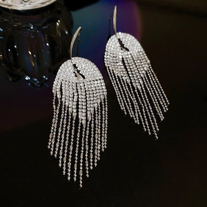 Silver geometric tassel earrings with pavé crystals and long shimmering fringes