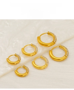Detail shot of three sets of 18K gold plated stainless steel hoop earrings with tiny crystals