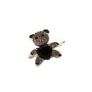Adjustable golden bear ring featuring white zircon paving and a black heart-shaped stone