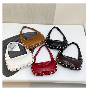Detailed top view of five stylish oily leather underarm bags with rivet stud accents