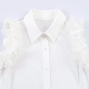 Women's white sleeveless shirt with 3D floral accents and lapel collar on white background