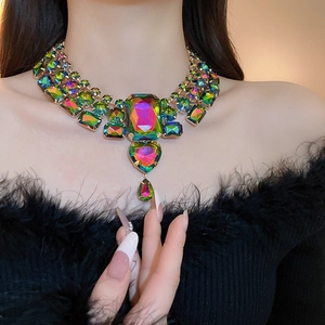 Detailed shot of multilayered necklace with heart and teardrop iridescent rhinestones