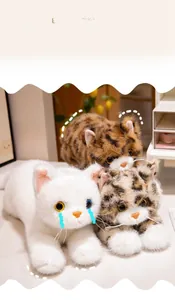 Detailed view of three realistic plush cats showing long fur texture and vivid facial features