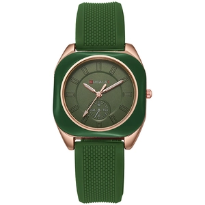 Detailed close-up of a green quartz watch featuring a rose gold case and small seconds dial