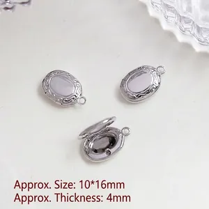 Macro detail of 10x16mm vintage silver oval locket pendants with ornate floral engravings