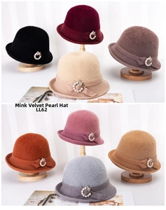 Detail view of eight elegant mink cashmere cloche hats with pearl ring decorations