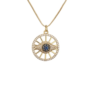Golden necklace with evil eye pendant featuring blue and clear micro-paved crystals