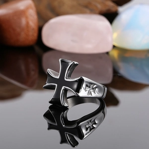 Detailed close-up of vintage stainless steel ring with black oil drip cross design