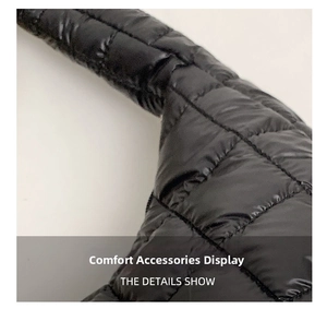 Detail of a black puffer quilted wide shoulder strap for a fashion dumpling bag