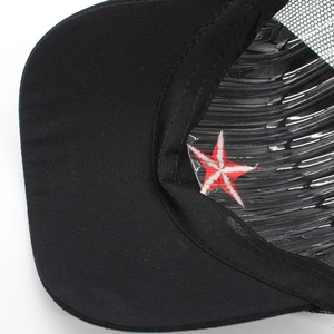 Close-up of the black camouflage mesh cap interior showing stitching and sweatband