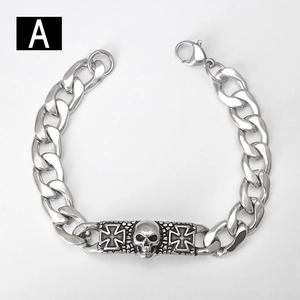Detail of silver skull relief and cross pattern on gothic stainless steel chain