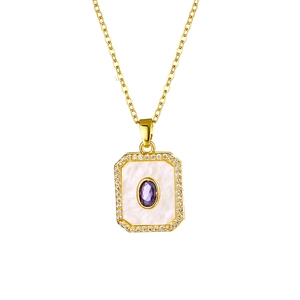 Macro detail of 18K gold plated pendant featuring a purple oval stone and clear zircons