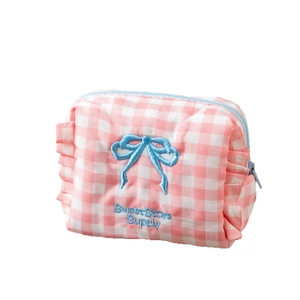 Pink checkered cosmetic bag with blue bow embroidery and ruffled edge decoration