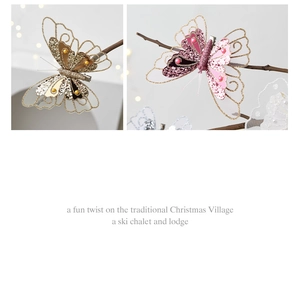 Detail of sequined butterfly clips in gold and pink on festive branches for Christmas decor