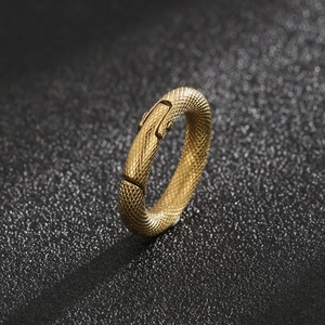Polished gold stainless steel ring featuring detailed snake scale pattern on black surface