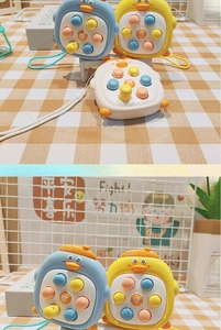 Detail of cute duck fidget toy keychain with silicone buttons and braided strap
