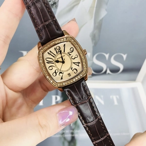 Elegant rose gold square watch with crystal bezel and brown leather strap on model's hand