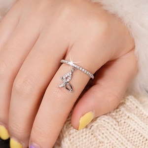 Detailed macro view of silver butterfly ring with shimmering cubic zirconia pavé stones