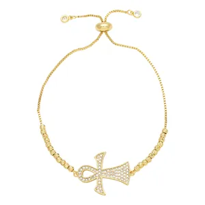 Adjustable gold Ankh cross bracelet with micro-paved zircons and elegant sliding buckle