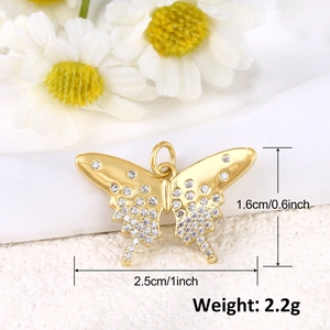 Macro shot of 18k gold plated butterfly charm with rhinestones and size specifications
