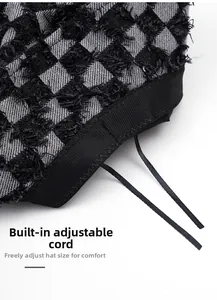 Detail view of denim checkerboard bucket hat showing the adjustable inner drawstring